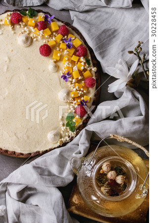 Chocolate tart with mango and raspberries 30228458