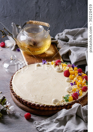 Chocolate tart with mango and raspberries Chocolate tart with mango and raspberries 30228459