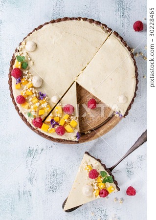 Chocolate tart with mango and raspberries 30228465