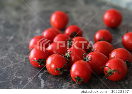 Fresh bright and juicy tomatoes on the kitchen Fresh bright and juicy tomatoes on the kitchen 30228597