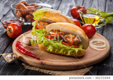 Hot dog with Tomato, lettuce, Sausage, mustard Hot dog with Tomato, lettuce, Sausage, mustard 30231044