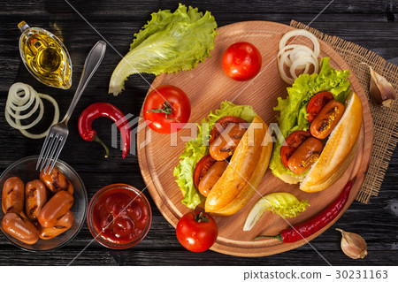 Hot dog with Tomato, lettuce, Sausage, mustard 30231163