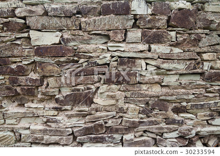 wall made of river stones 30233594
