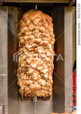 Shawarma grilling on spit 30235218