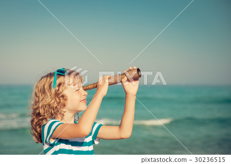 Happy kid playing outdoor against sea and sky Happy kid playing outdoor against sea and sky 30236515
