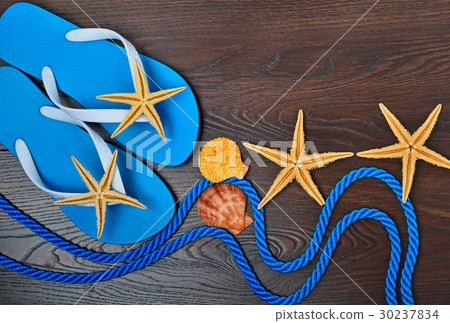 Flip-flops, starfish and seashells. Flip-flops, starfish and seashells. 30237834