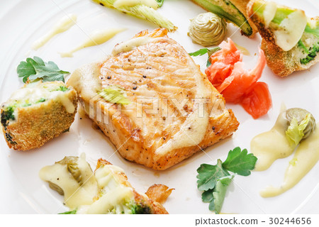 salmon steak with vegetables 30244656