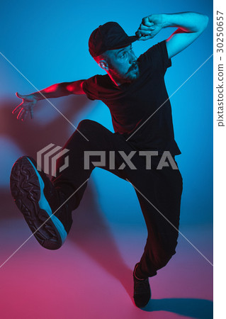 The silhouette of one hip hop male break dancer The silhouette of one hip hop male break dancer 30250657