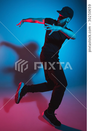 The silhouette of one hip hop male break dancer The silhouette of one hip hop male break dancer 30250659