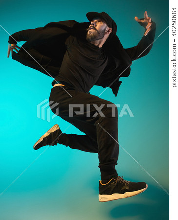 The silhouette of one hip hop male break dancer The silhouette of one hip hop male break dancer 30250683