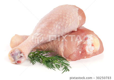 Two raw chicken drumsticks with a sprig of dill Two raw chicken drumsticks with a sprig of dill 30250783