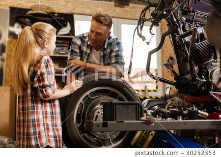 Delighted cool father chatting with his child 30252353