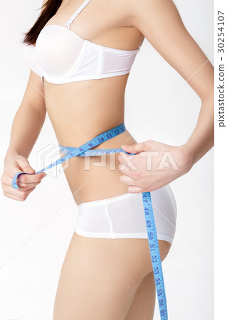 young woman measuring her perfect slim body iwith young woman measuring her perfect slim body iwith 30254107