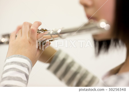 Female students playing instruments Female students playing instruments 30256348