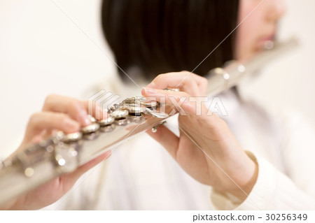 Female students playing instruments Female students playing instruments 30256349