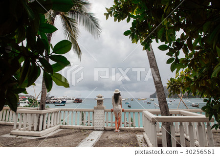 The girl in the hat is enjoying the view from the 30256561