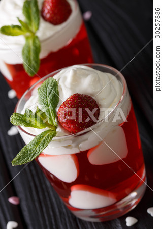 Festive strawberry jelly with whipped cream 30257886