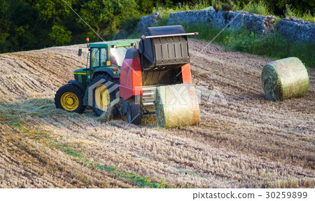round baler is an agricultural machine  30259899