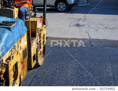 Worker on light vibration roller compactor asphalt 30259902