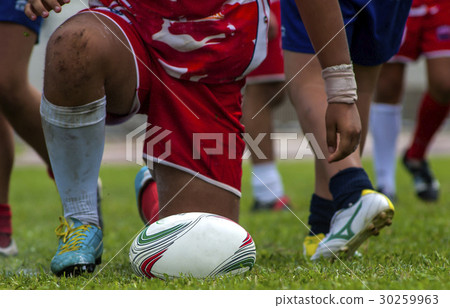 Rugby players scrum during a game, close up ball Rugby players scrum during a game, close up ball 30259963