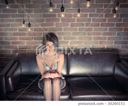 Young woman with a sexy body in underwear on sofa Young woman with a sexy body in underwear on sofa 30260151