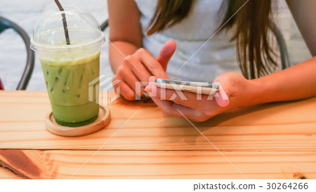 Young woman and smartphones 30264266