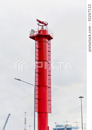 High red lighthouse in sea port 30267510