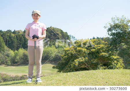 Young women playing golf 30273600