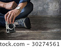 cropped image of man holding vintage camera 30274561