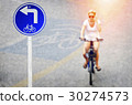 Signpost biking trails with arrow  30274573