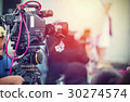 Video camera operator working with his equipment 30274574