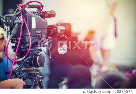 Video camera operator working with his equipment 30274574