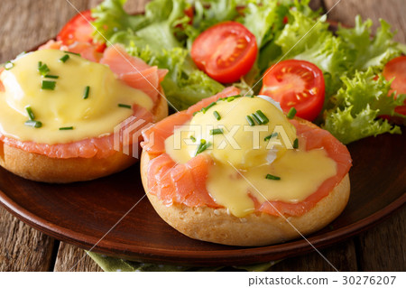 Eggs Benedict with salmon and hollandaise sauce Eggs Benedict with salmon and hollandaise sauce 30276207