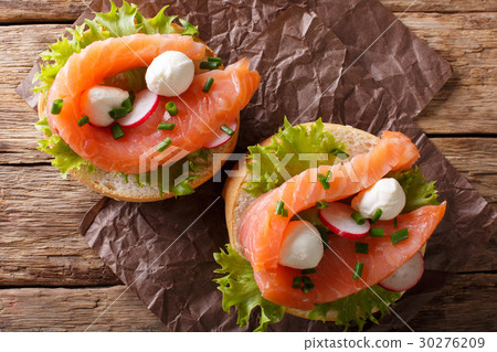sandwiches with smoked salmon, mozzarella, lettuce 30276209