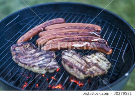 delicious grilled meat over coal on barbecue grill 30279581