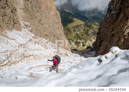 hiker on footpath Sella Ronda mountain south Tyrol 30284594