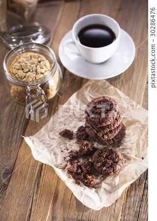 Delicious coffee with sweets on a wooden table 30286476