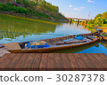 Wood table on landscape river  30287378