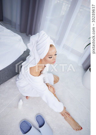 beautiful young woman wearing a towel and a white bathrobe and a beautiful young woman wearing a towel and a white bathrobe and a 30289637