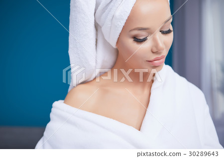 beautiful young woman wearing a towel and a white bathrobe and a beautiful young woman wearing a towel and a white bathrobe and a 30289643
