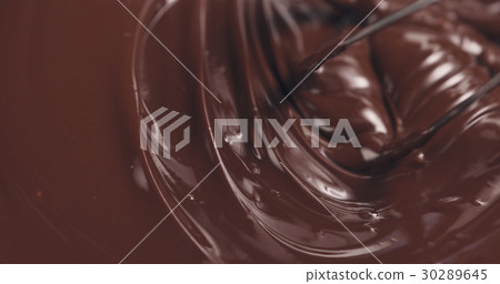 mixing melted premium dark chocolate with a whisk mixing melted premium dark chocolate with a whisk 30289645