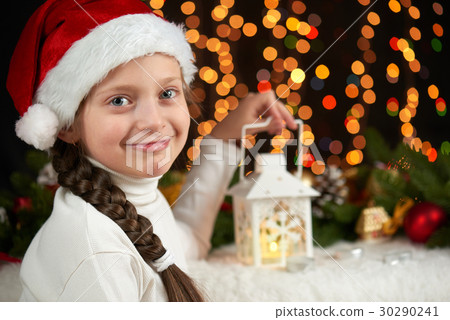 child girl portrait, christmas decoration on dark 30290241