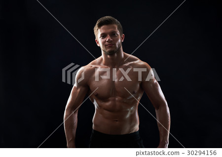 Young muscular fit sportsman posing shirtless on 30294156