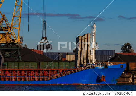 Blue cargo ship loading 30295404
