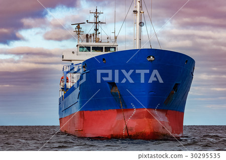 Blue cargo ship moored 30295535