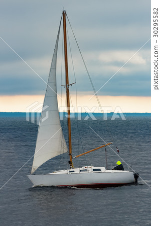 White sailboat traveling 30295582