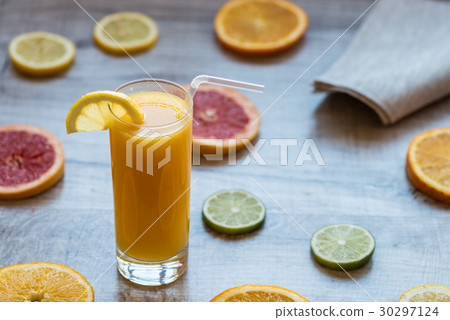 glass of orange juice on the wood background with glass of orange juice on the wood background with 30297124