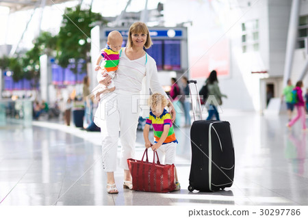 Family at airport before flight 30297786