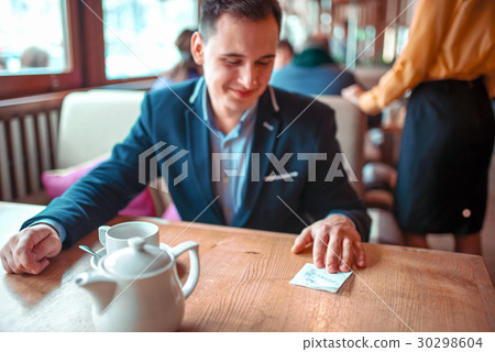 Happy man read love note with a phone number Happy man read love note with a phone number 30298604