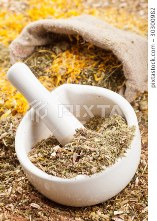 mortar, pestle and sack of healing herbs 30300982